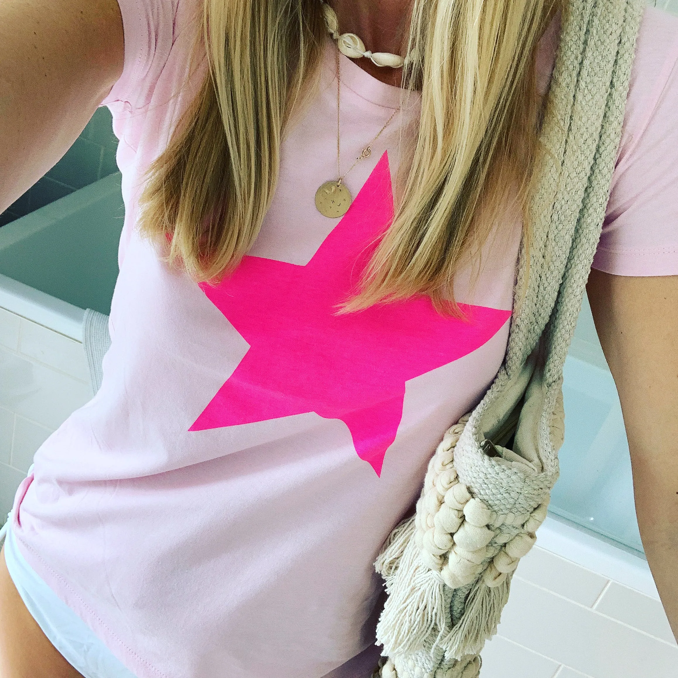 Neon pink star on pink tee