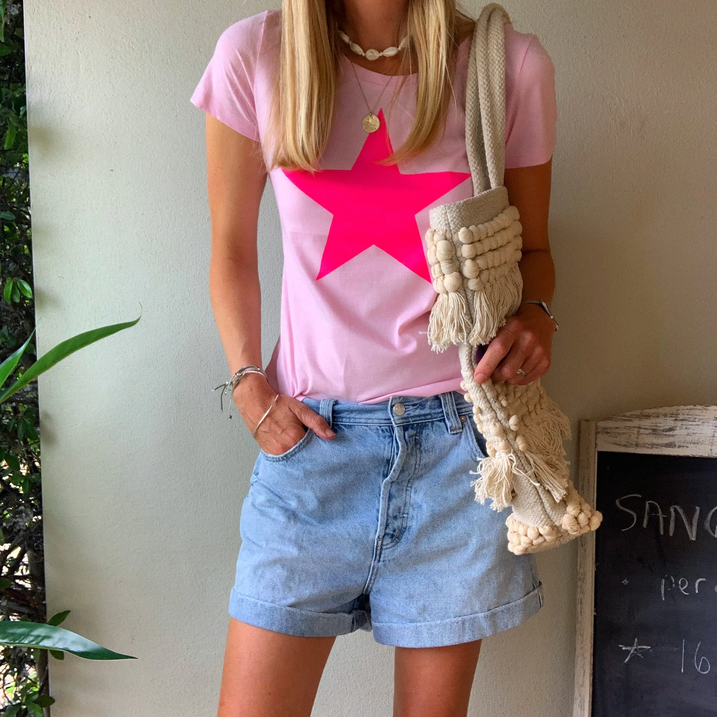 Neon pink star on pink tee
