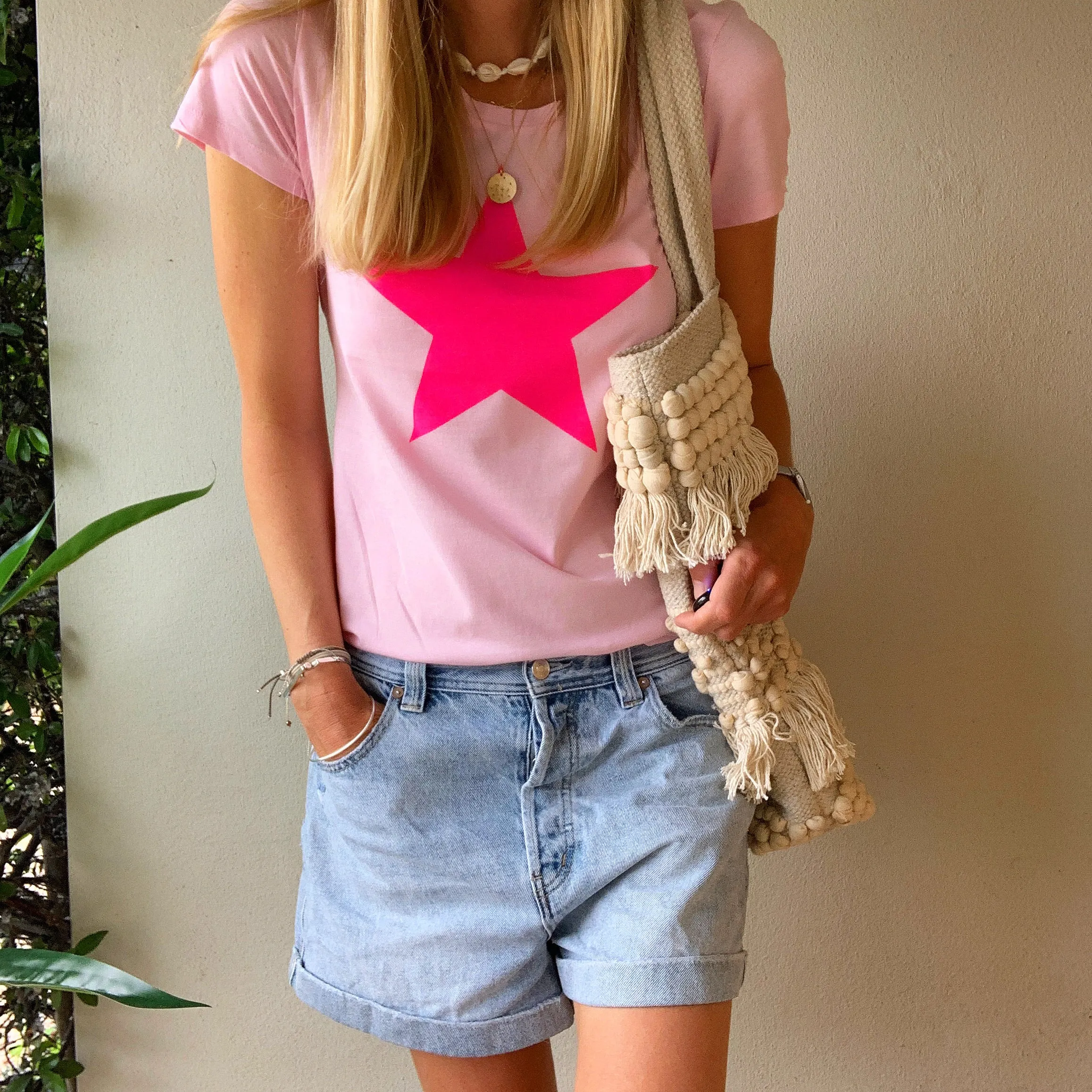 Neon pink star on pink tee