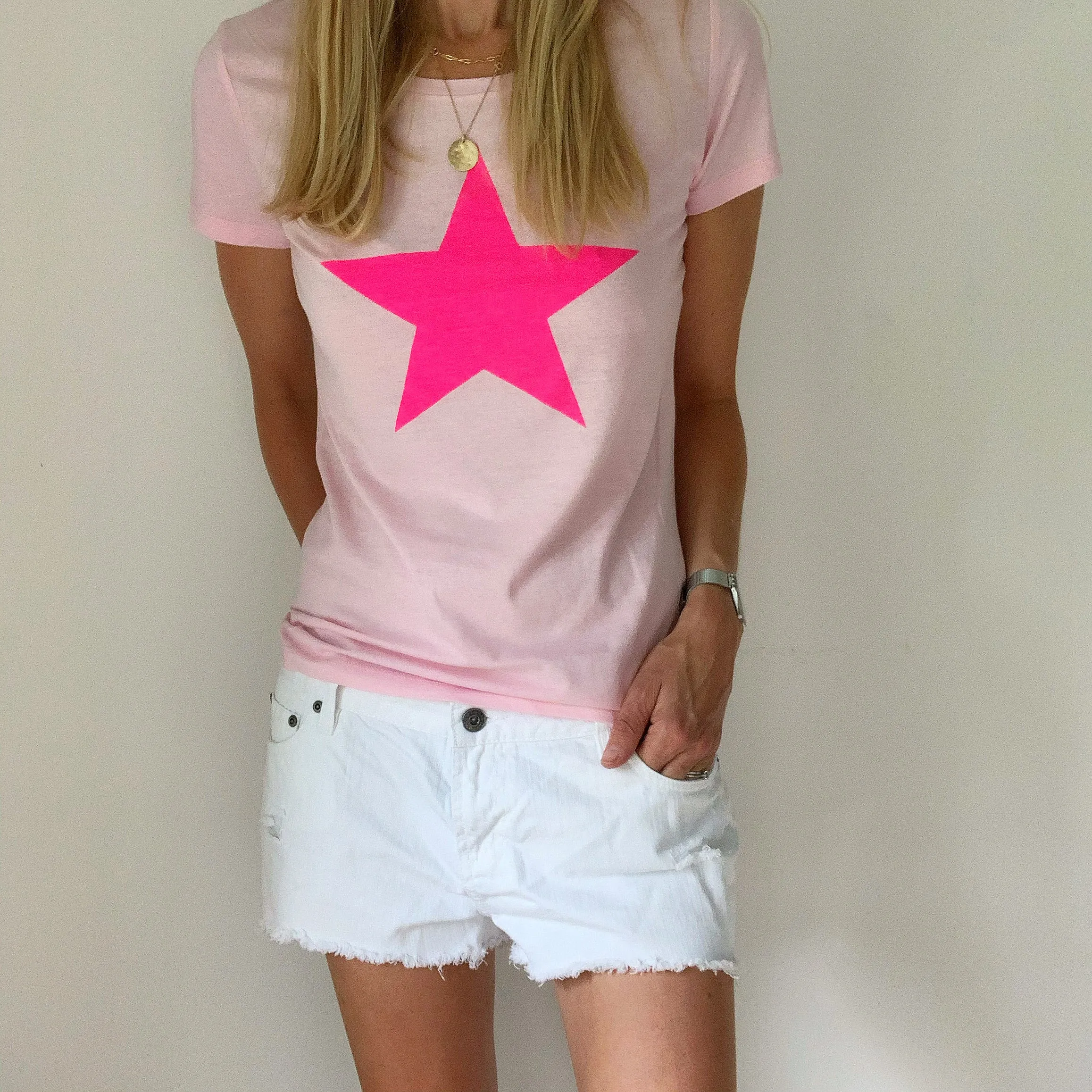 Neon pink star on pink tee