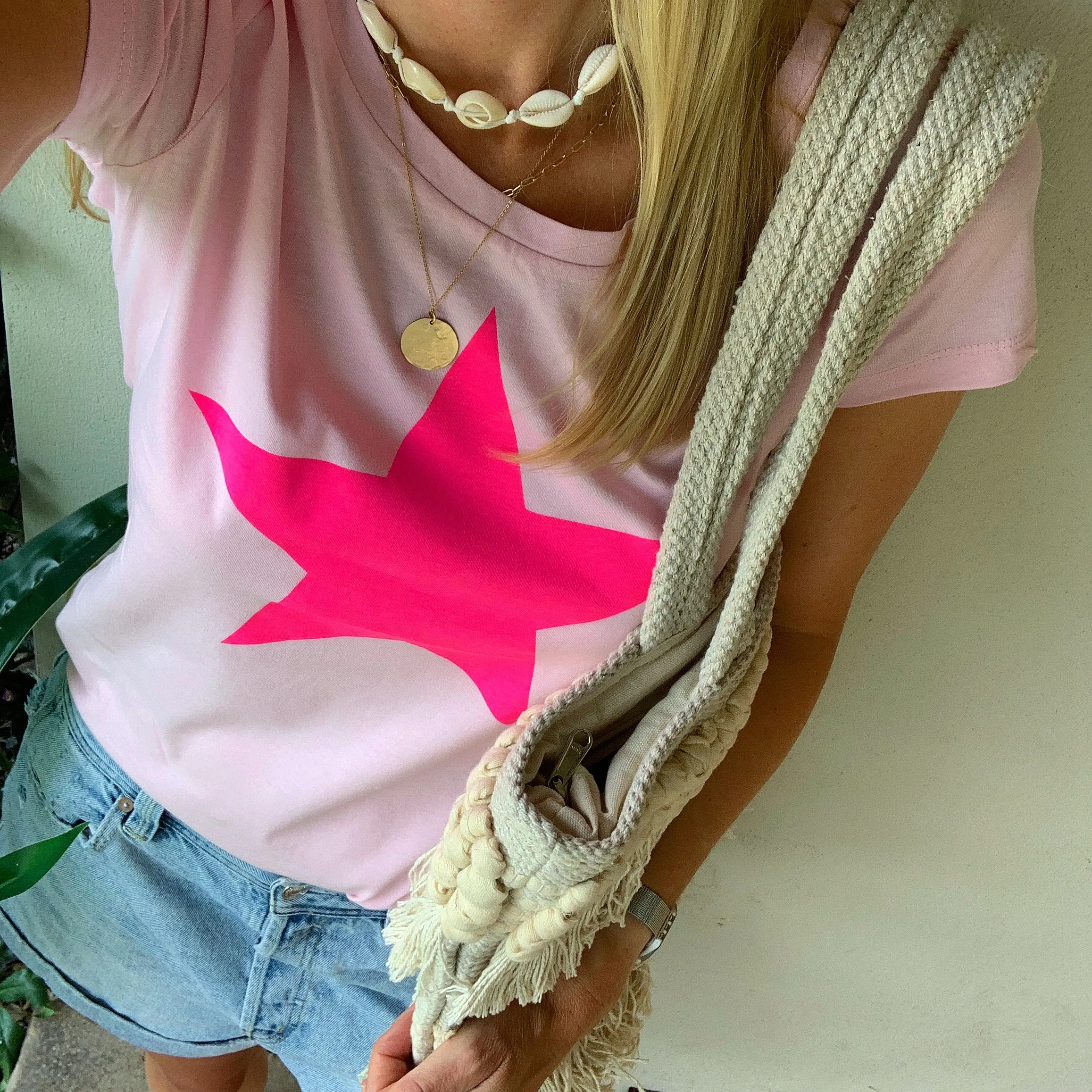 Neon pink star on pink tee